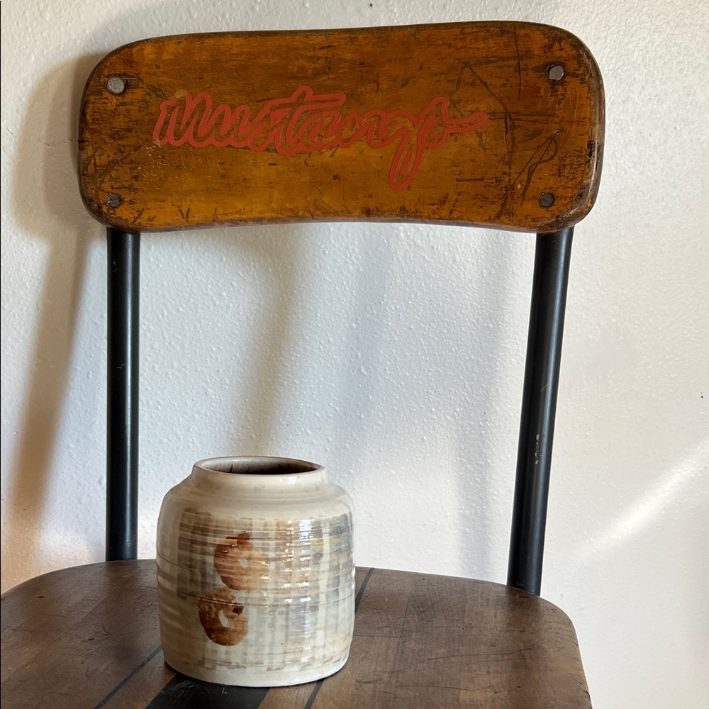 Handmade ceramic pottery vase with glazed design on front